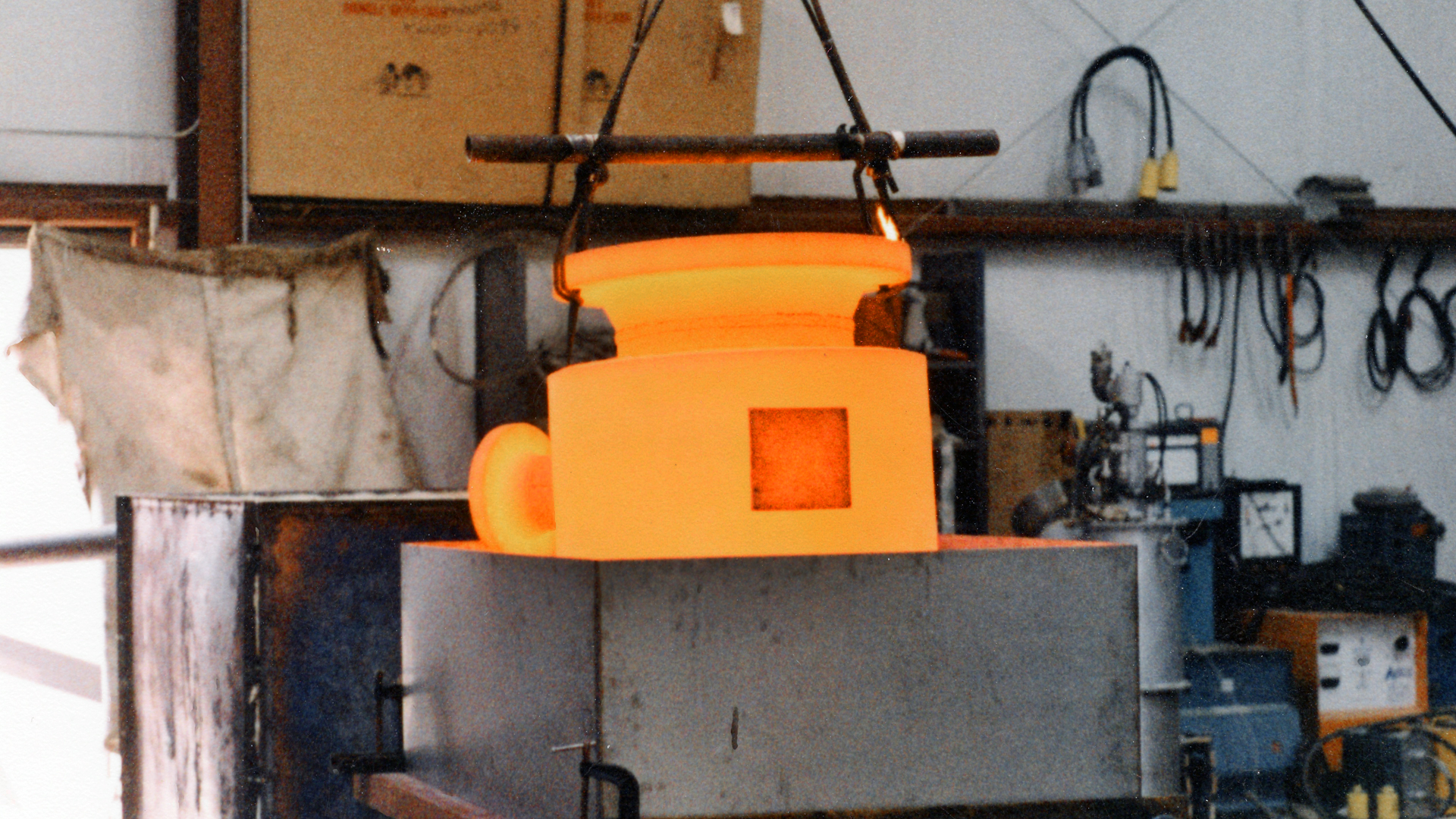 Pressure vessel for a major chemical company being solution annealed. The part is removed at 1,950° F then quenched.